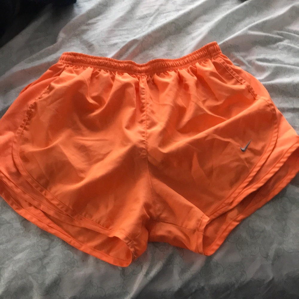 Neon orange Nike shorts